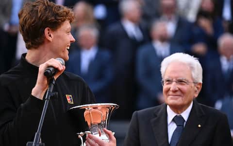 Jannik Sinner (L) of Italy with the trophy and Italian President of the Republic, Sergio Mattarella (R), during the award ceremony after winning his men's final match against Casper Ruud of Norway (not pictured) at the Italian Open tennis tournament in Rome, Italy, 17 May 2026. ANSA/RICCARDO ANTIMIANI
