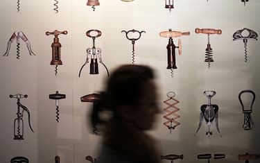 A woman visits the "Corkscrew Museum" in Barolo, northern Italy, on November 16, 2016. The Museo dei Cavatappi (Corkscrew Museum) offers 500 specimens from the 18th century to today, of various artistic periods, countries, and types. The collection traces the birth and evolution through the centuries of this accessory used to open a bottle of wine.  / AFP / MARCO BERTORELLO        (Photo credit should read MARCO BERTORELLO/AFP via Getty Images)