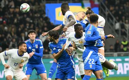 France's forward #14 Adrien Rabiot (up R) scores the opening goal during the Nations League group A2 football match between Italy and France at San Siro stadium in Milan, on November 17, 2024. (Photo by Alberto PIZZOLI / AFP)