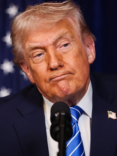 PALM BEACH, FLORIDA - DECEMBER 28: U.S. President Donald Trump listens during a press conference with Ukrainian President Volodymyr Zelensky following their meeting at Trump’s Mar-a-Lago club on December 28, 2025 in Palm Beach, Florida. Trump invited Zelensky to his private club to work on the U.S.-proposed peace plan to end the war in Ukraine, as the conflict approaches four years since the sudden full-scale invasion by Russia on February 24, 2022. (Photo by Joe Raedle/Getty Images)