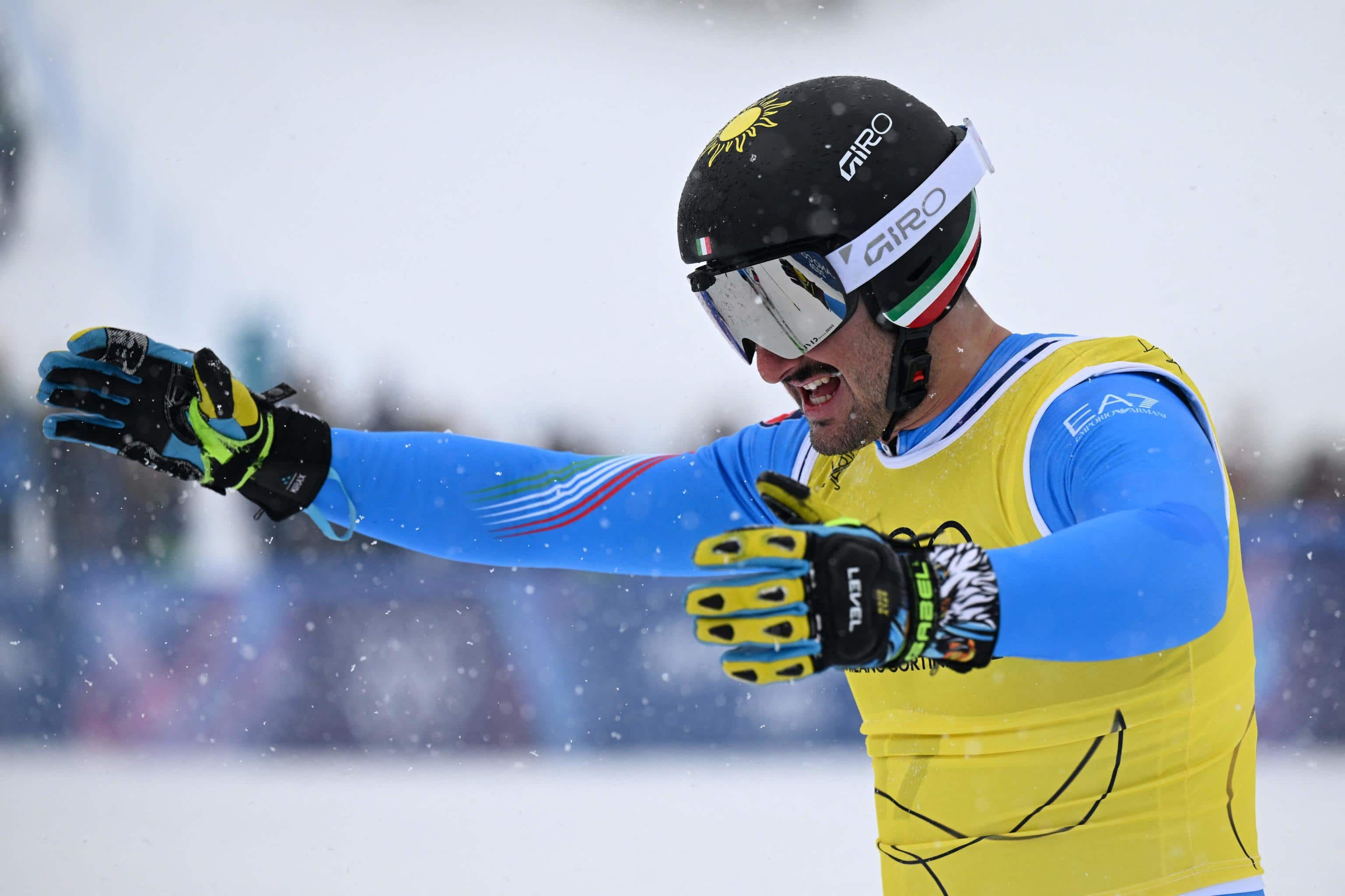 Italy's Federico Tomasoni celebrates after finishing second in the freestyle skiing men's ski cross final during the Milano Cortina 2026 Winter Olympic Games at Livigno Snow Park, in Livigno (Valtellina), on February 21, 2026. (Photo by Kirill KUDRYAVTSEV / AFP)