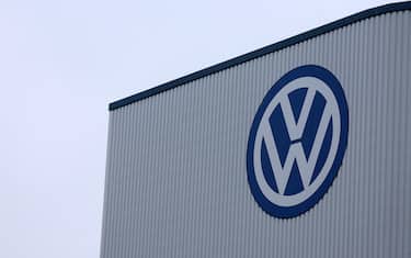 epa11584077 The Volkswagen logo is seen at the Volkswagen (VW) vehicle factory in Osnabruck, Germany, 04 September 2024. Europe's largest car manufacturer announced that it would tighten austerity measures at its core VW brand. Volkswagen Group said it can no longer rule out plant closures in Germany.  EPA/CHRISTOPHER NEUNDORF