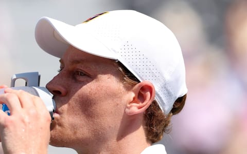 LONDON, ENGLAND - JUNE 24: Jannik Sinner of Italy drinks during a break in his exhibition match against Cameron Norrie of Great Britain during the Giorgio Armani Tennis Classic at The Hurlingham Club on June 24, 2026 in London, England. (Photo by Clive Brunskill/Getty Images)