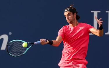 epa11570258 Lorenzo Musetti of Italy in action against Miomir Kecmanovic of Serbia (unseen) during their second round match of the US Open Tennis Championships at the USTA Billie Jean King National Tennis Center in Flushing Meadows, New York, USA, 28 August 2024. The US Open tournament runs from 26 August through 08 September.  EPA/SARAH YENESEL