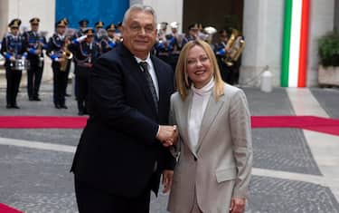 Italian Prime Minister Giorgia Meloni (R) welcomes Hungarian Prime Minister Viktor Orban (L) at the Chigi palace in Rome, Italy, 27 October 2025.  ANSA/MASSIMO PERCOSSI