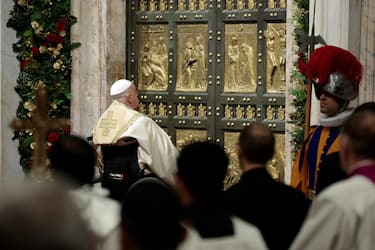 Pope Francis opens the Holy Door to mark the opening of the 2025 Catholic Holy Year, or Jubilee, in St. Peter's Basilica, at the Vatican, December 24, 2024. REUTERS/Remo Casilli/Pool