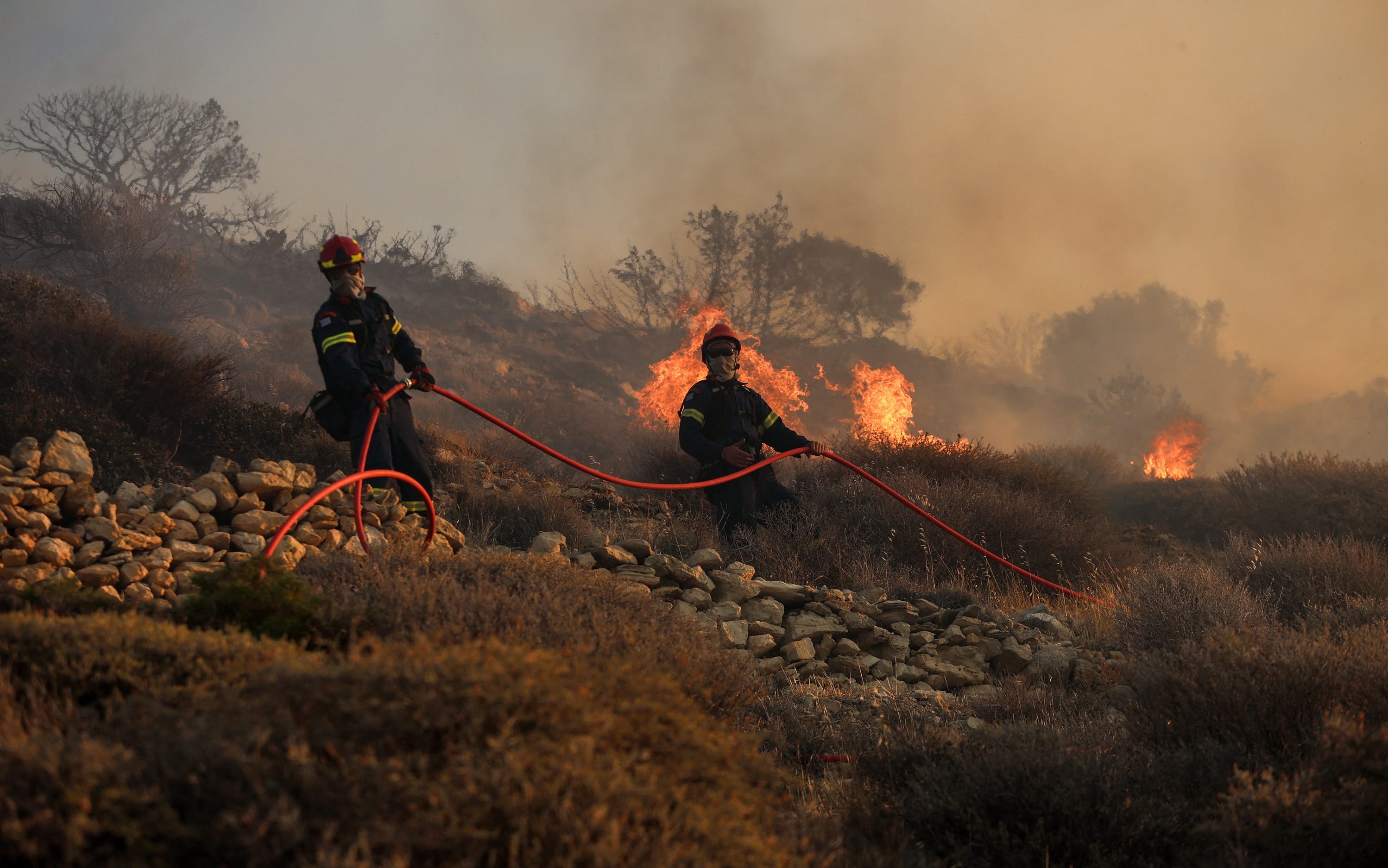 Firefighters battle the flames that keep burning forests and farmland near Ierapetra on the island of Crete, Greece, on July 3, 2025. Two major wildfires, one on the island of Crete and another near the port town of Rafina east of Athens, have forced the evacuation of more than 5,000 residents and tourists, Greek authorities said on Thursday. Photo by Stefanos Repanis/Xinhua/ABACAPRESS.COM