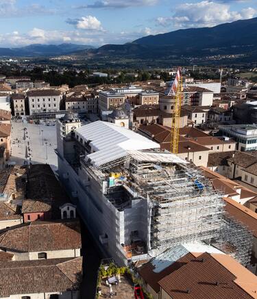A drone view shows L'Aquila Cathedral building site on September 21st, 2024. Cathedral of Saints Maximus and George was severely damaged by the earthquake of April 6, 2009, which struck the city of L'Aquila and the surrounding areas. The cathedral is a religious and historical symbol for the city, dating back to the 13th century, although it has undergone numerous modifications over the centuries, particularly after the earthquakes of 1703 and 1915. Reconstruction work, which began in 2023, is expected to be completed in 2028 according to initial forecasts. The project is divided into two functional phases, aligned with the funding sources, and it will take five years before the Cathedral can be reopened. (Photo by Lorenzo Di Cola/NurPhoto via Getty Images)