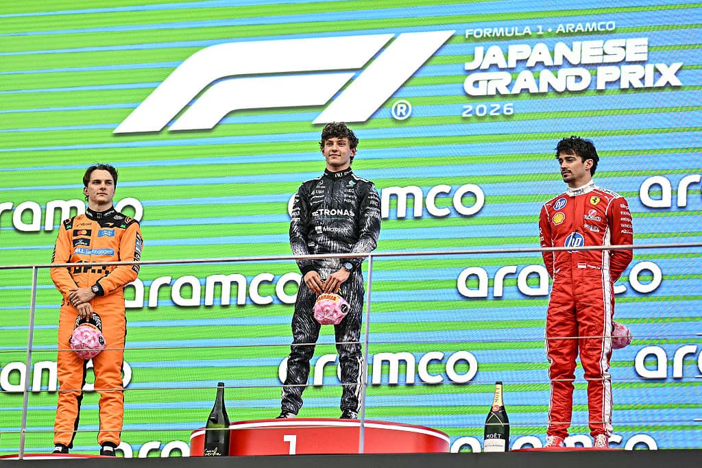 Winner Mercedes' Italian driver Kimi Antonelli (C), second-placed McLaren's Australian driver Oscar Piastri (L) and third-placed Ferrari's Monegasque driver Charles Leclerc (R) stand on the podium after the Formula One Japanese Grand Prix at the Suzuka circuit in Suzuka, Mie prefecture on March 29, 2026. (Photo by Philip FONG / AFP via Getty Images)