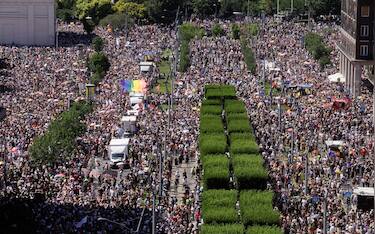 People take part in the Budapest Pride parade in Budapest downtown on June 28, 2025, as the capital's municipality organised this march by the LGBTQ community, celebrating freedom, in a move to circumvent a law that allows police to ban LGBTQ marches. Hungary's Prime Minister had announced that police will not "break up" Saturday's Budapest Pride march despite issuing a ban, but warned attendees and organisers about the legal consequences. His ruling coalition amended laws and the constitution earlier this year to prohibit the annual celebration, advancing his widely condemned, years-long clampdown on LGBTQ rights in the name of "child protection". (Photo by Peter Kohalmi / AFP)
