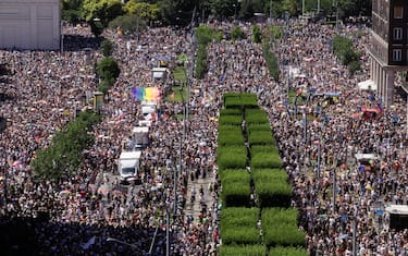 People take part in the Budapest Pride parade in Budapest downtown on June 28, 2025, as the capital's municipality organised this march by the LGBTQ community, celebrating freedom, in a move to circumvent a law that allows police to ban LGBTQ marches. Hungary's Prime Minister had announced that police will not "break up" Saturday's Budapest Pride march despite issuing a ban, but warned attendees and organisers about the legal consequences. His ruling coalition amended laws and the constitution earlier this year to prohibit the annual celebration, advancing his widely condemned, years-long clampdown on LGBTQ rights in the name of "child protection". (Photo by Peter Kohalmi / AFP)