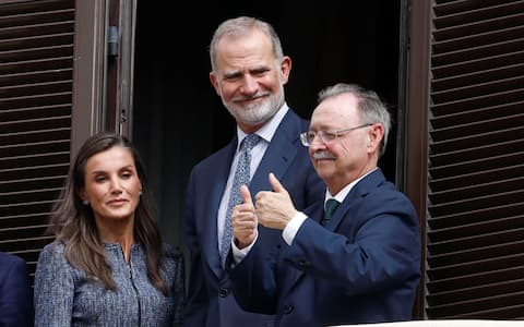 epa13300131 Spain's King Felipe VI (C) and Queen Letizia (L) greet the crowd from the Town Hall's balcony along with Mayor-President o Ceuta Juan Jesus Vivas (R) in Ceuta, Spain, 13 October 2026. This is the Spanish royal couple's first visit to Spain's North African enclaves, Ceuta and Melilla.  EPA/CHEMA MOYA