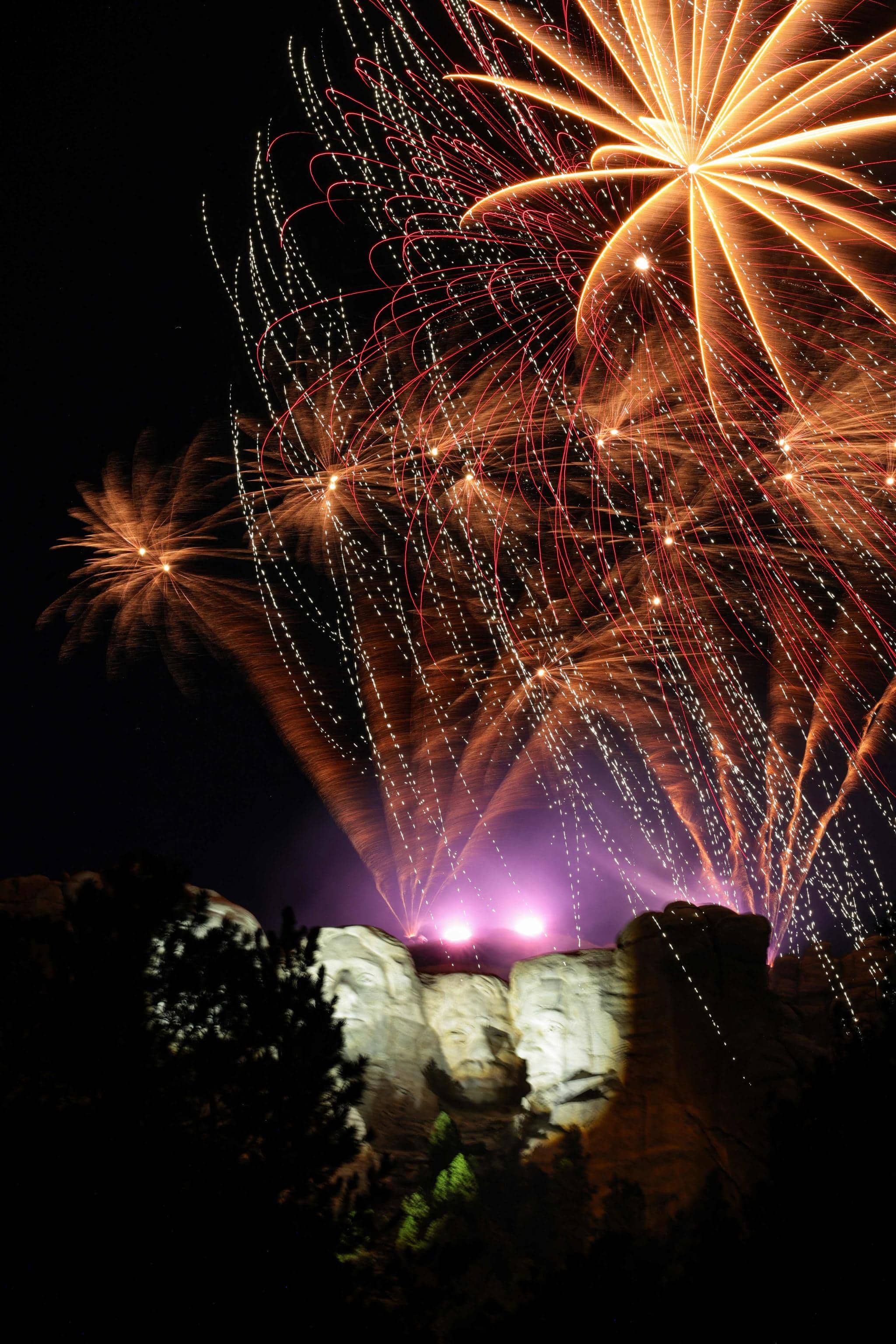 KEYSTONE, SOUTH DAKOTA - JULY 03: Fireworks explode in the air above Mount Rushmore National Memorial after U.S. President Donald Trump held a rally on July 03, 2026 in Keystone, South Dakota. Trump is holding a rally and fireworks show at Mount Rushmore, kicking off a weekend of 250th Independence Day celebrations across the country.   Chip Somodevilla/Getty Images/AFP (Photo by CHIP SOMODEVILLA / GETTY IMAGES NORTH AMERICA / Getty Images via AFP)