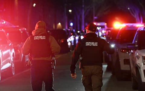 PROVIDENCE, RHODE ISLAND  DECEMBER 13: Emergency responders work at the scene near Brown University in Providence, Rhode Island, on December 13, 2025, following a mass shooting that left at least two people dead and eight others injured. Authorities said police launched a search for the suspect, who remained at large, while campus officials urged students and staff to shelter in place as the investigation continued. (Photo by Kyle Mazza/Anadolu via Getty Images)
