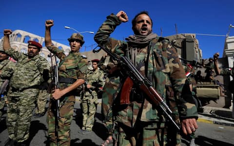 epa10915207 Houthi fighters shout slogans during a military parade in solidarity with Palestinians in the Gaza Strip, in Sana'a, Yemen, 12 October 2023. The top leader of the Houthis movement, Abdul-Malik al-Houthi, has warned that his movement will stand ready to engage in hostilities against Israel should the United States directly back the Israeli military campaign on the Gaza Strip. Thousands of Israelis and Palestinians have died since the militant group Hamas launched an unprecedented attack on Israel from the Gaza Strip on 07 October 2023, leading to Israeli retaliation strikes on the Palestinian enclave.  EPA/YAHYA ARHAB