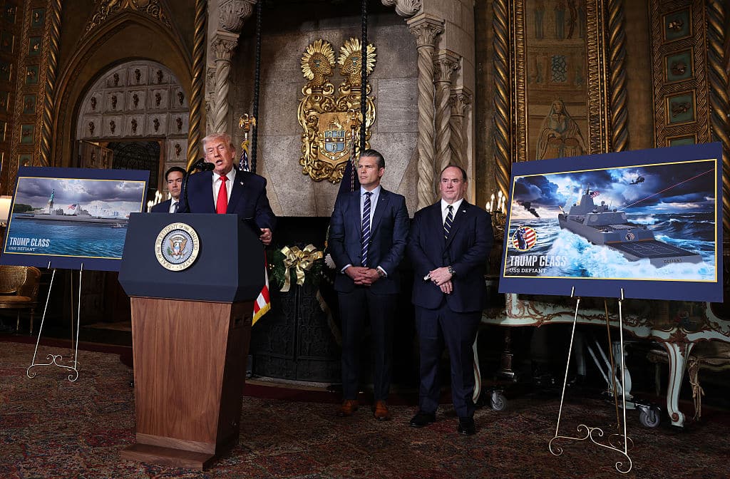 PALM BEACH, FLORIDA - DECEMBER 22: U.S. President Donald Trump, joined by Secretary of State Marco Rubio (L), Secretary of War Pete Hegseth, and Secretary of the Navy John Phelan, announces the creation of the â  Trump-classâ   battleship during a statement to the media at Trumpâ  s Mar-a-Lago estate on December 22, 2025 in Palm Beach, Florida. Trump announced the new class of battleship will become the centerpiece of his â  Golden Fleetâ   program to rebuild and strengthen the U.S. shipbuilding industry. (Photo by Tasos Katopodis/Getty Images)
