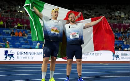 BIRMINGHAM, ENGLAND - AUGUST 10: Gold medalist Leonardo Fabbri of Team Italy, Silver medalist Zane Weir of Team Italy pose for a photo with the national flags, after competing in the Men's Shot Put Final during day one of the 27th European Athletics Championships at Alexander Stadium on August 10, 2026 in Birmingham, England. (Photo by Sona Maleterova/Getty Images)