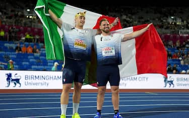 BIRMINGHAM, ENGLAND - AUGUST 10: Gold medalist Leonardo Fabbri of Team Italy, Silver medalist Zane Weir of Team Italy pose for a photo with the national flags, after competing in the Men's Shot Put Final during day one of the 27th European Athletics Championships at Alexander Stadium on August 10, 2026 in Birmingham, England. (Photo by Sona Maleterova/Getty Images)