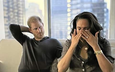 BGUK_2532905 - Los Angeles, CA  - Meghan Markle breaks down in tears in Netflix documentary as she discusses being trolled on social media and getting death threats. Both Meghan and Harry hit out at hateful social media and the credibility given to it by journalists who repeat the ‘hateful’ comments or write stories about it. Harry declared: “I think it’s unethical and an abuse of power.” But it’s Meghan who claims she’s been left scared by threatening Tweets and by stories printed in the papers. Megan wiped away tears as she said: “When you plant a seed that is so hateful, what it can grow into…I mean just a couple of days ago I was going through the manual for the security team at home and on one of the pages I happened to flip to it was about online monitoring. Like: ‘If you see a Tweet like this, please report it to head of security immediately’. And it said: ‘Meghan just needs to die. Someone needs to kill her, maybe it should be me’. And I like: ‘Ok, that’s what’s actually out in the world because of people creating hate’. And I’m a mom, that’s my real life. And then you see it and you go: ‘That’s making people want to kill me’. It’s not just a tabloid, it’s not just some story. You are making me scared. And then that night, I was up all night, looking up and down the hallway, saying: ‘Are we safe? Are the doors locked? Is the security on? That’s real. Are my babies safe? And you’ve created it for what? Because you’re bored? Or because it sells your papers? Or it makes you feel better about your own life? It’s real what you’re doing.” Later in the documentary she is shown crying again after she has a guided meditation session with Prince Harry. The voice of Prince Harry and Meghan's guided meditation instructor is heard telling the couple to inhale and exhale as they sit on a sofa with their palms facing up at the ceiling. She tells the couple: “Remember that what is transpiring in the media, what's being created, is an illusion. When you try to prove that you're good and that you're not the person they say you are, you're taking the bait, you're feeding the beast. It is an illusion. Your work is not to prove your goodness. You know who you are, both of you.” After being told that their session has come to an end, Meghan has tears streaming down her face. Meghan then wipes away the tears as her visibly emotional husband leans his head back on the sofa.  Harry then says: “As sad as it is, in order for change to happen, sometimes a lot of pain has to come to the surface.
Pictured: Meghan Markle, Prince Harry
BACKGRID UK 15 DECEMBER 2022 
BYLINE MUST READ: Netflix / BACKGRID
*BACKGRID DOES NOT CLAIM ANY COPYRIGHT OR LICENSE IN THE ATTACHED MATERIAL. ANY DOWNLOADING FEES CHARGED BY BACKGRID ARE FOR BACKGRID'S SERVICES ONLY, AND DO NOT, NOR ARE THEY INTENDED TO, CONVEY TO THE USER ANY COPYRIGHT OR LICENSE IN THE MATERIAL. BY PUBLISHING THIS MATERIAL , THE USER EXPRESSLY AGREES TO INDEMNIFY AND TO HOLD BACKGRID HARMLESS FROM ANY CLAIMS, DEMANDS, OR CAUSES OF ACTION ARISING OUT OF OR CONNECTED IN ANY WAY WITH USER'S PUBLICATION OF THE MATERIAL*
UK: +44 208 344 2007 / uksales@backgrid.com
USA: +1 310 798 9111 / usasales@backgrid.com
*UK Clients - Pictures Containing Children
Please Pixelate Face Prior To Publication*