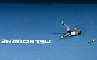 Spain's Carlos Alcaraz celebrates after winning against Serbia's Novak Djokovic in their men's singles final match on day fifteen of the Australian Open tennis tournament in Melbourne on February 1, 2026. (Photo by Saeed Khan / AFP) / -- IMAGE RESTRICTED TO EDITORIAL USE - STRICTLY NO COMMERCIAL USE --