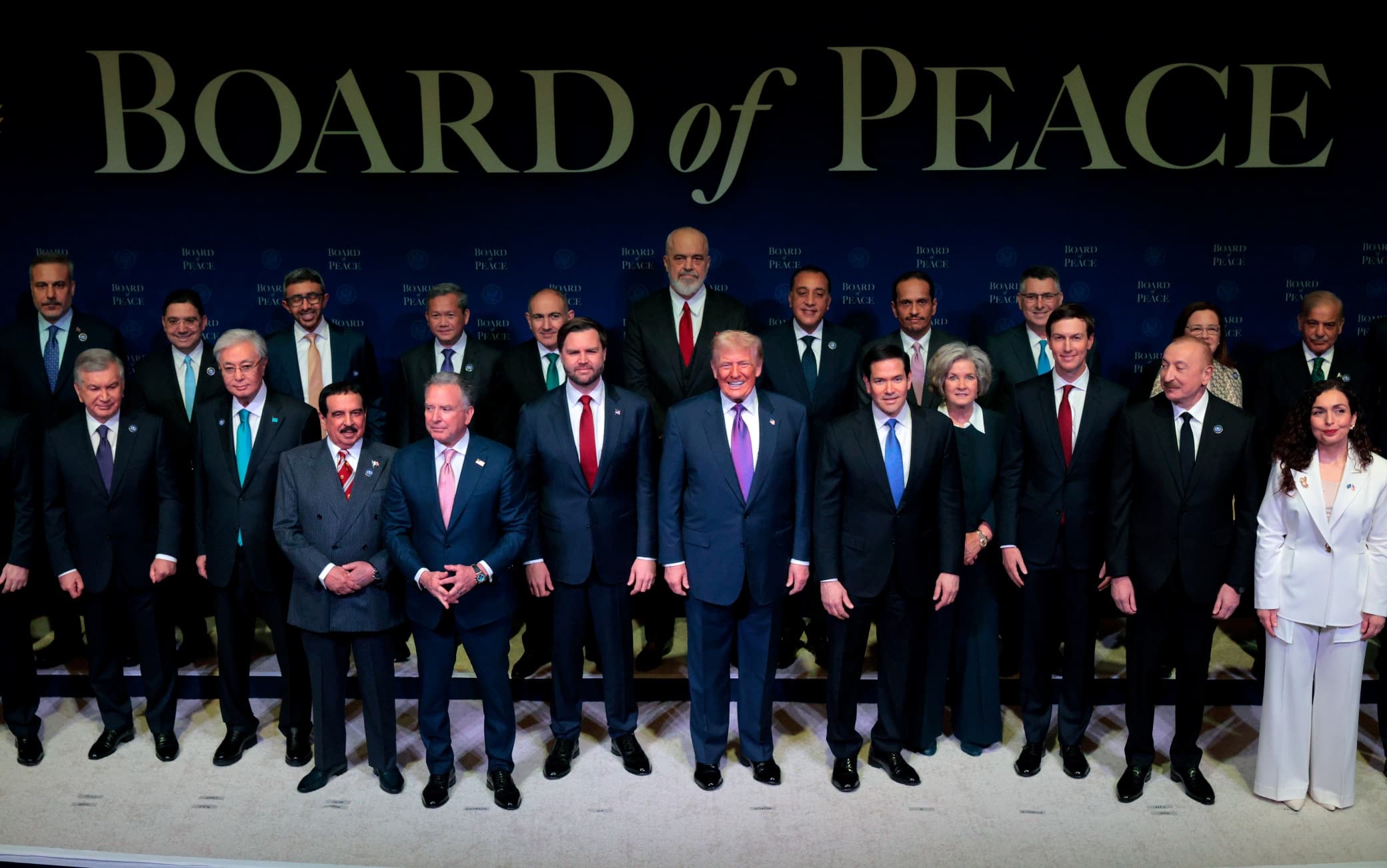 WASHINGTON, DC - FEBRUARY 19: U.S. President Donald Trump is joined for a family photo along with U.S. Vice President JD Vance, U.S. Secretary of State Marco Rubio, White House Chief of Staff Susie Wiles, Jared Kushner and other Board of Peace representatives during the inaugural meeting of the Board of Peace at the Institute of Peace on February 19, 2026 in Washington, DC. Assembled to raise money for the rebuilding and stabilization of Gaza, Trump's Board of Peace was formally established on the sidelines of World Economic Forum in January of 2026. (Photo by Chip Somodevilla/Getty Images)