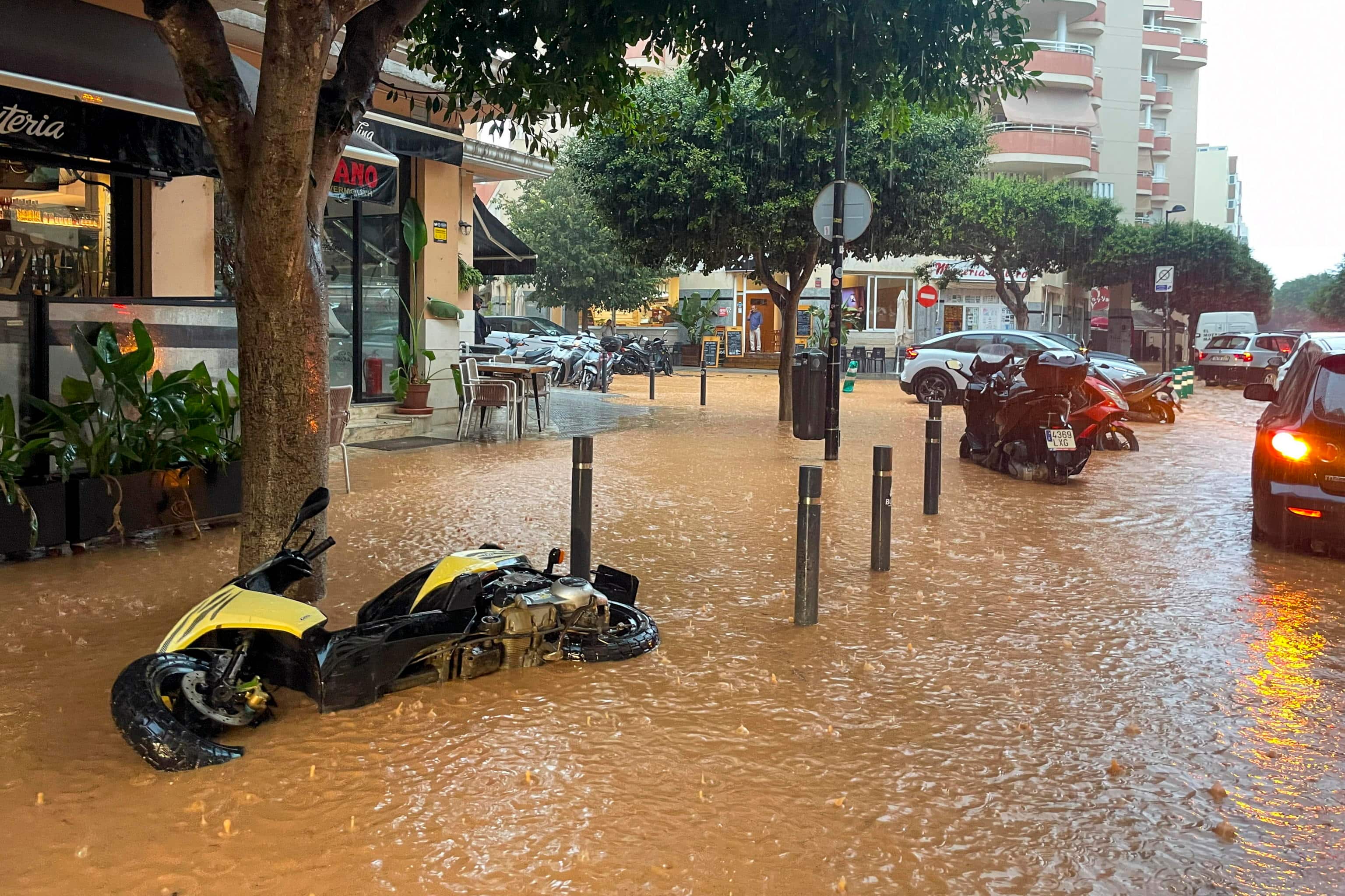 epa12416592 Flooded streets in Ibiza, Spain, 30 September 2025, after heavy rains that have caused several floods throughout the island. Spain's State Meteorological Agency (Aemet) issued red, orange and yellow alerts for heavy rains affecting several regions across the country.  EPA/Sergio G. Canizares