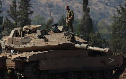epa11630004 Israeli soldiers man tanks at a gathering point in northern Israel, 28 September 2024. The Israeli army (Tsahal) said on 28 September that military forces continue to strike infrastructure sites of the Hezbollah organization in Lebanon. The army struck over 140 Hezbollah targets since midnight 28 September, including launchers aimed at Israeli civilians, and buildings in which weapons were stored, the report said. Hezbollah leader Hassan Nasrallah was killed in an overnight strike on Beirut, the Hezbollah and Tsahal confirmed in statements on 28 September 2024.  EPA/ATEF SAFADI