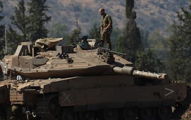 epa11630004 Israeli soldiers man tanks at a gathering point in northern Israel, 28 September 2024. The Israeli army (Tsahal) said on 28 September that military forces continue to strike infrastructure sites of the Hezbollah organization in Lebanon. The army struck over 140 Hezbollah targets since midnight 28 September, including launchers aimed at Israeli civilians, and buildings in which weapons were stored, the report said. Hezbollah leader Hassan Nasrallah was killed in an overnight strike on Beirut, the Hezbollah and Tsahal confirmed in statements on 28 September 2024.  EPA/ATEF SAFADI