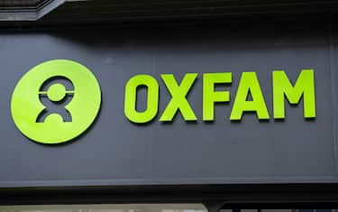 CARDIFF, WALES - JULY 11: A close-up of an Oxfam store sign on July 11, 2023 in Cardiff, Wales. (Photo by Matthew Horwood/Getty Images)