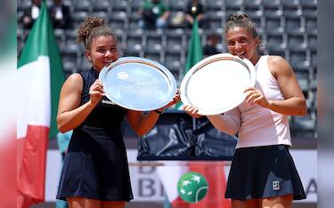 ROME, ITALY - MAY 18: Jasmine Paolini of Italy and Sara Errani of Italy pose for a photo with their trophies after their victory against Veronika Kudermetova and Elise Mertens of Belgium during the Women's Doubles Final match on Day Fourteen of the Internazionali BNL D'Italia 2025 at Foro Italico on May 18, 2025 in Rome, Italy.  (Photo by Dan Istitene/Getty Images)