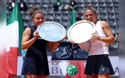 ROME, ITALY - MAY 18: Jasmine Paolini of Italy and Sara Errani of Italy pose for a photo with their trophies after their victory against Veronika Kudermetova and Elise Mertens of Belgium during the Women's Doubles Final match on Day Fourteen of the Internazionali BNL D'Italia 2025 at Foro Italico on May 18, 2025 in Rome, Italy.  (Photo by Dan Istitene/Getty Images)