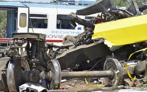 The trains wreckage are removed at the site of the head-on commuter train collision that occurred Tuesday between the towns of Andria and Corato, in the southern Puglia region, Italy, 13 July 2016. The official death toll of train crash is 23 fatalities and none missing, Governor Michele Emiliano said Wednesday based on a coroner's report. He said 52 wounded were treated and 24 remain hospitalized, eight of them in reserved prognosis. ANSA/ GAETANO LO PORTO