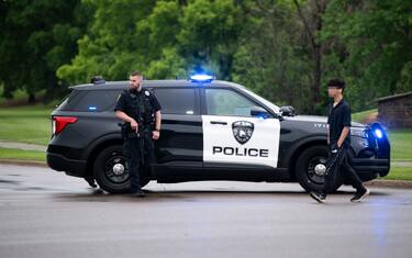 BROOKLYN PARK, MINNESOTA - JUNE 14: A Brooklyn Park police officer looks on as they guard the entrance to a neighborhood on June 14, 2025 in Brooklyn Park, Minnesota. Democratic-Farmer-Labor State Rep. Melissa Hortman and her husband were shot and killed this morning. Democratic-Farmer-Labor State Sen. John Hoffman and his wife were also shot and hospitalized in a separate incident. Minnesota Gov. Tim Walz said during a press conference that the shooting "appears to be a politically motivated assassination." (Photo by Stephen Maturen/Getty Images)