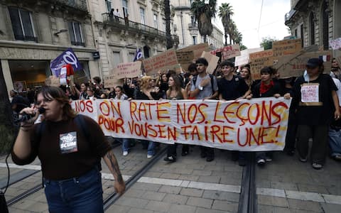 epa13284857 High school students and members of education unions march with a banner reading 'We are missing our lessons to give you one' during a national day of protest against education conditions in Montpellier, southern France, 06 October 2026. The demonstration comes amid a nationwide wave of protests across France against severe teacher shortages, overcrowded classrooms, a lack of resources, and poor learning conditions ahead of upcoming national budget decisions.  EPA/GUILLAUME HORCAJUELO
