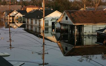NEW ORLEANS - SEPTEMBER 09:  Houses are seen submerged under water September 9, 2005 in New Orleans, Louisiana. Thousands of residents of the Gulf Coast are still without electricity or access to basic amenities after the devastating hurricane swept through the area twelve days ago, likely claiming the lives of thousands.  (Photo by Justin Sullivan/Getty Images)