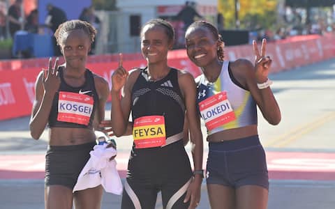 CHICAGO, ILLINOIS - OCTOBER 11: Ethiopian runner Hawi Feysa crosses the finish line to win the women's professional division at the 48th Bank of America Chicago Marathon in Chicago, United States on October 11, 2026. Over 55,000 participants competed on the 26.2-mile course starting and finishing in Grant Park. (Photo by Jacek Boczarski/Anadolu via Getty Images)