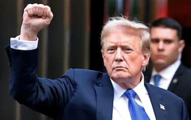 epa11380747 Former US President Donald Trump gestures to the media and the crowd outside of Trump Tower after a jury found him guilty on all 34 counts in his criminal trial in New York State Supreme Court in New York, New York, USA, 30 May 2024. Trump was found guilty on all 34 felony counts of falsifying business records related to payments made to adult film star Stormy Daniels during his 2016 presidential campaign.  EPA/PETER FOLEY