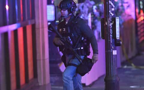 PROVIDENCE, RHODE ISLAND  DECEMBER 13: Emergency personnel escort students from one of the buildings of Brown University in Providence, Rhode Island, on December 13, 2025, following a mass shooting that left at least two people dead and eight others injured. Authorities said police launched a search for the suspect, who remained at large, while campus officials urged students and staff to shelter in place as the investigation continued. (Photo by Kyle Mazza/Anadolu via Getty Images)