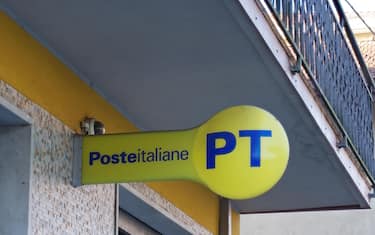MASSA CARRARA, ITALY - OCTOBER 26, 2019: Italian Post Office sign, logo in corporate yellow and blue.