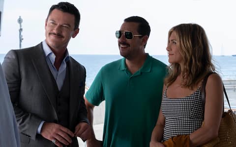 Luke Evans as Charles Cavendish, Adam Sandler as Nick Spitz and Jennifer Aniston as Audrey Spitz in MURDER MYSTERY