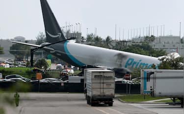 MIAMI, FLORIDA - SEPTEMBER 06:  An Amazon cargo plane is seen after it crashed at Miami International Airport on September 06, 2026 in Miami, Florida. In a statement, the Federal Aviation Administration said Prime Air Flight 7598 overran the runway while landing around 2 p.m. after departing from Luis Muñoz Marín International Airport in San Juan, Puerto Rico, earlier today. (Photo by Joe Raedle/Getty Images)