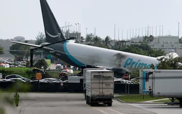 MIAMI, FLORIDA - SEPTEMBER 06:  An Amazon cargo plane is seen after it crashed at Miami International Airport on September 06, 2026 in Miami, Florida. In a statement, the Federal Aviation Administration said Prime Air Flight 7598 overran the runway while landing around 2 p.m. after departing from Luis Muñoz Marín International Airport in San Juan, Puerto Rico, earlier today. (Photo by Joe Raedle/Getty Images)