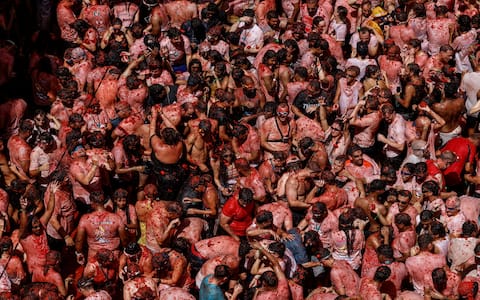 IPA87805428 - August 26, 2026, BuÃ±Ol, Valencia (Valencian Comm, Spain: Several participants in the Tomatina festival in BuÃ±ol celebrate during the event on 26 August 2026, in BuÃ±ol, Valencia, Valencian Community (Spain). La Tomatina is always held on the last Wednesday in August, as part of BuÃ±olâ€™s festival week, and involves participants throwing tomatoes at one another. Seven lorries were needed to transport the 150,000 kilos of tomatoes that were thrown in this unusual battle, which this year marks its 79th anniversary.[**********]..26 AUGUST 2026;CELEBRATIONS;TRADITION;FESTIVAL;EVENT;CULTURE..Rober Solsona / Europa Press..08/26/2026 (Credit Image: © Rober Solsona/Contacto via ZUMA Press)