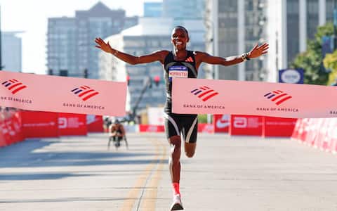 Kenyan runner Amos Kipruto crosses the finish line to win first place in the men's professional division during the 2026 Chicago Marathon in Chicago, Illinois on October 11, 2026. (Photo by KAMIL KRZACZYNSKI / AFP)