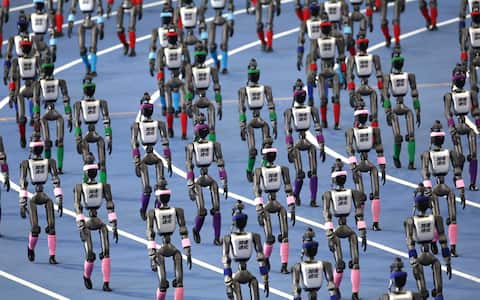 epa13184402 Humanoid robots parade during the 2026 World Humanoid Robot Games opening ceremony at the National Speed Skating Oval in Beijing, China, 22 August, 2026. The 2026 World Humanoid Robot Games are being held in Beijing until 26 August.  EPA/ANDRES MARTINEZ CASARES