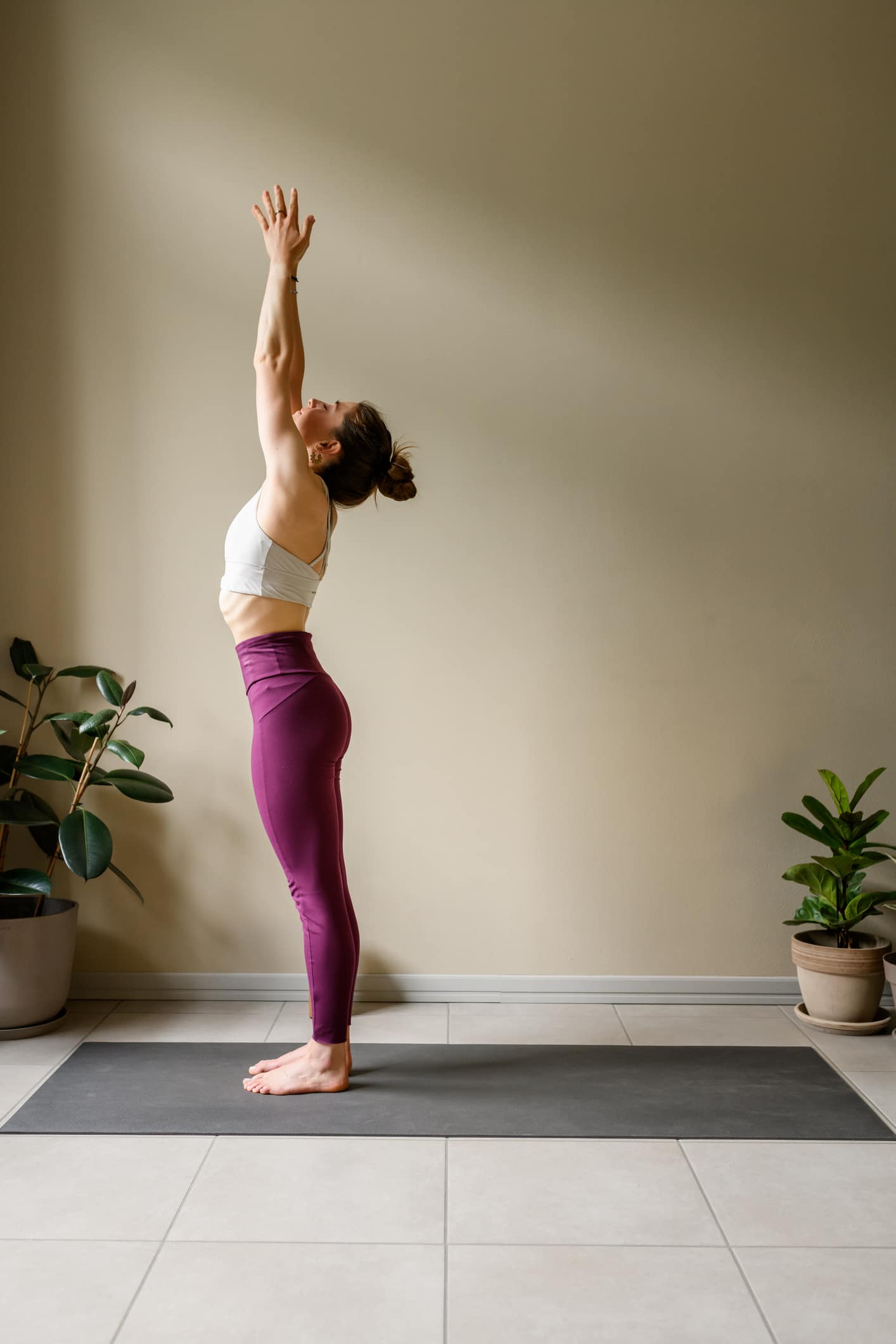 Professional woman practicing yoga at home: Mountain, Tadasana