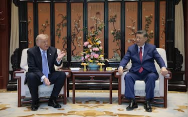 US President Donald Trump (L) meets with China’s President Xi Jinping on the sidelines of their visit to Zhongnanhai Garden in Beijing on May 15, 2026. (Photo by Evan Vucci / POOL / AFP)