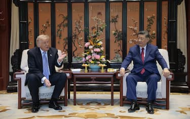 US President Donald Trump (L) meets with China’s President Xi Jinping on the sidelines of their visit to Zhongnanhai Garden in Beijing on May 15, 2026. (Photo by Evan Vucci / POOL / AFP)