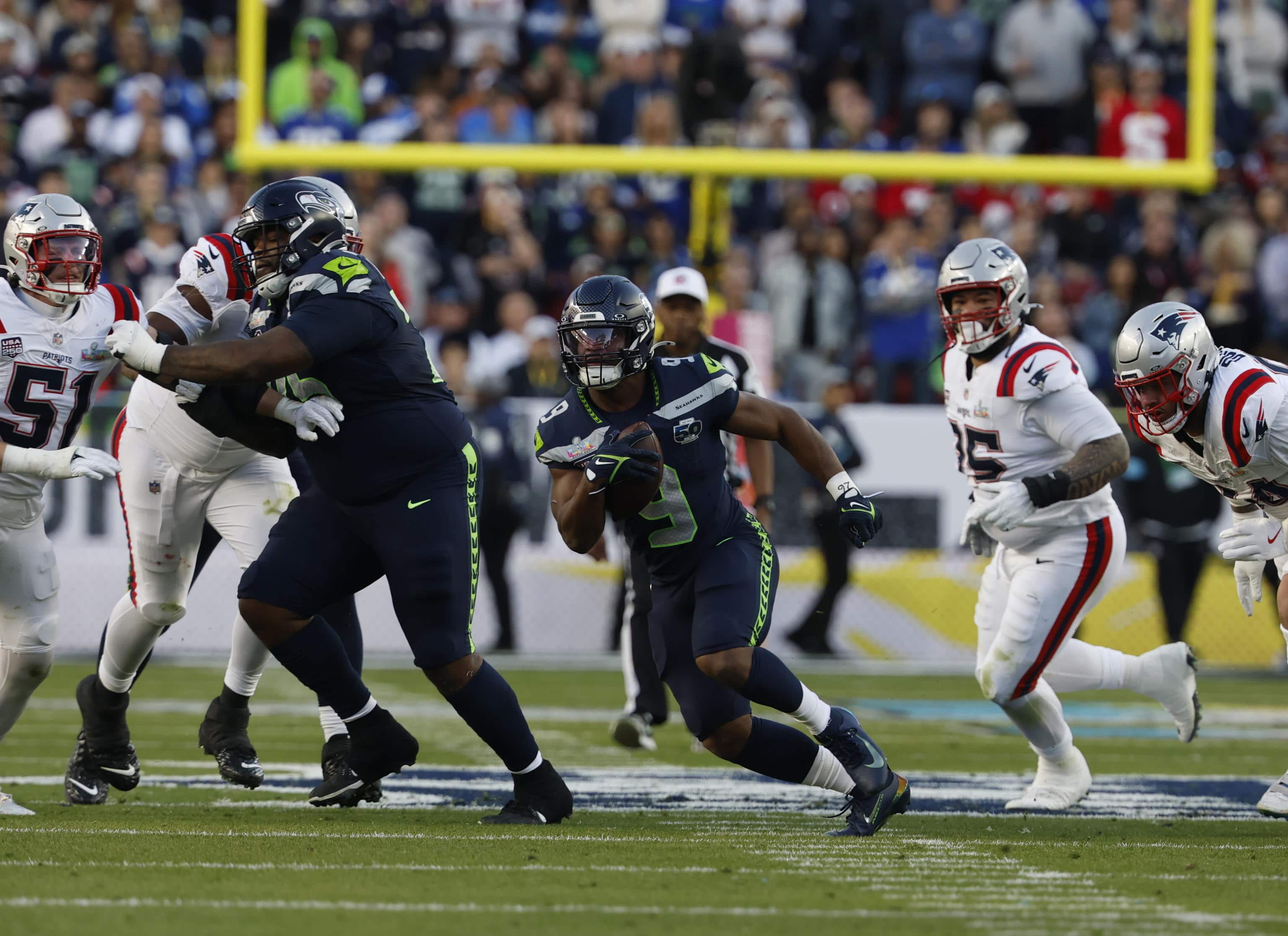 epa12718717 Seattle Seahawks running back Kenneth Walker III (C) runs with the ball during the first half of NFL Super Bowl LX between the New England Patriots and the Seattle Seahawks at Levi s Stadium in Santa Clara, California, USA, 08 February 2026.  EPA/JOHN G. MABANGLO