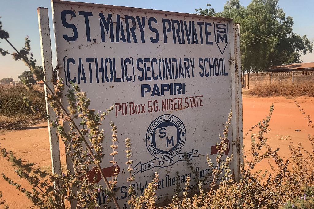 A signboard for St Mary's Private Catholic Secondary School stands at the entrance of the school in Papiri, Agwarra local government, Niger state, on November 23, 2025. Fifty of the more than 300 children snatched by gunmen from a Catholic school in Nigeria have escaped their captors, a Christian group said in a statement on November 23. 
"We have received some good news as fifty pupils escaped and have reunited with their parents," said the Christian Association of Nigeria in a statement, adding they escaped between November 21 and 22.
Gunmen raided early November 21 St Mary's co-education school in Niger state in western Nigeria, taking 303 children and 12 teachers in one of the largest mass kidnappingsÂ inÂ Nigeria. (Photo by Ifeanyi Immanuel Bakwenye / AFP via Getty Images)